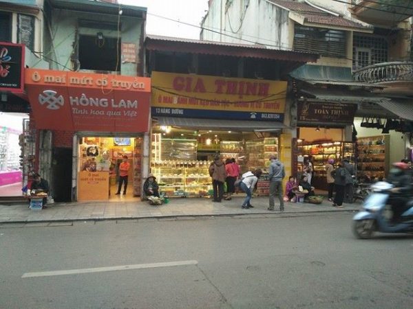 “Four sweet stores stand next to one another on “Hang Duong”, one of “36 streets” in Hanoi’s Old Quarter”