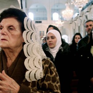 Syrian women praying at a Greek Orthodox church