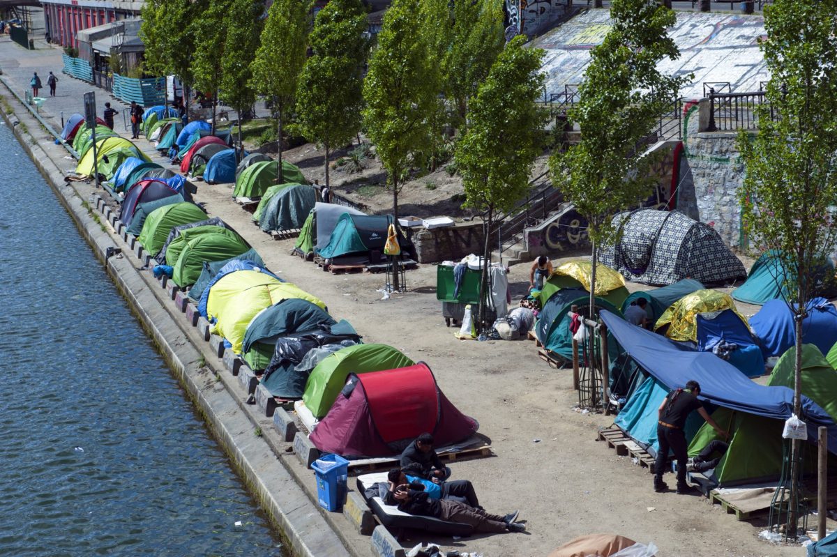 Tents of refugees along a river in France