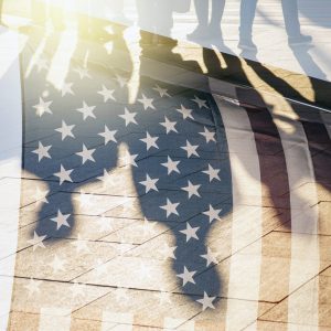 Shadows of People in a street and Flag of The USA as Background