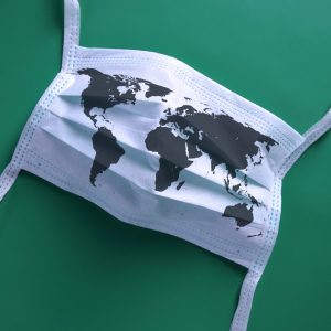 Disposable face mask printed with a map of the world