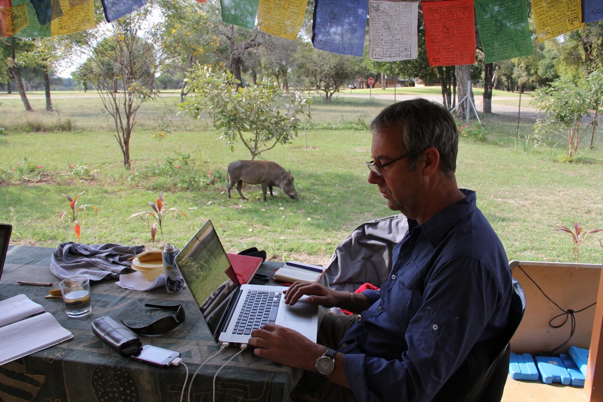 David Bunn wokring on his laptop while researching in South Africa
