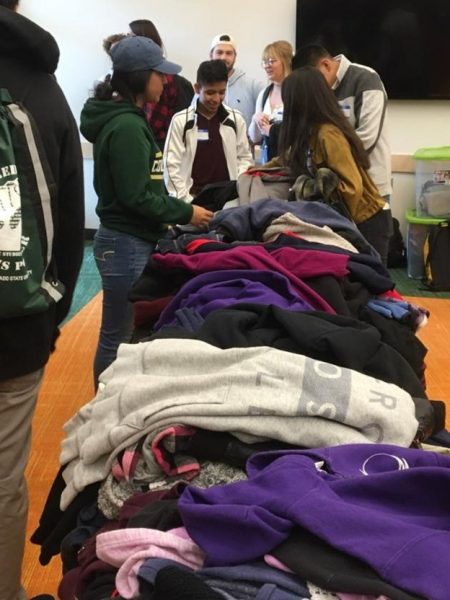 Ethnic studies students helping at a winter clothing drive