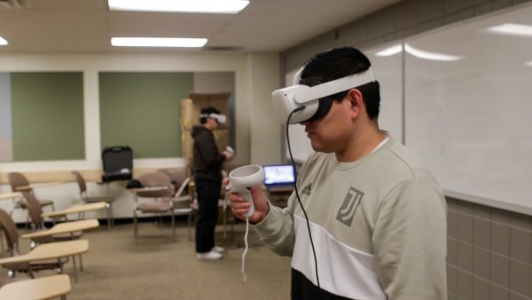 Student using virtual reality to practice speaking Spanish in a health care setting