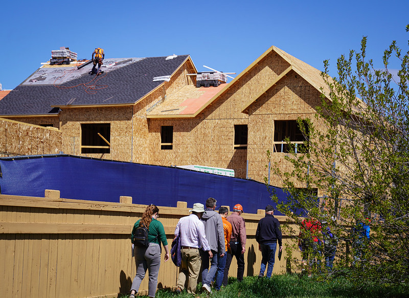 Neighborhood Development Liaison Emily Myler and her team observe a new housing development construction site