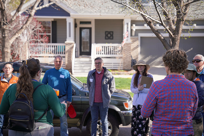 Emily Myler speaks a small group of 6 Fort Collins community members about a housing project