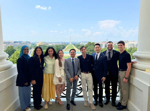 Justin Frigault with his cohort of Rangel Fellows at a monument in Washington DC