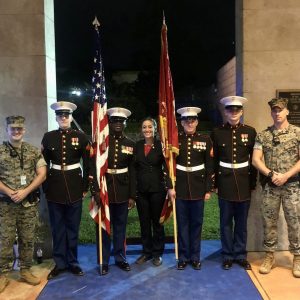 Hannah Fowler posing with members of the U.S. Armed Forces in uniform at the U.S. Embassy in Yaounde, Cameroon