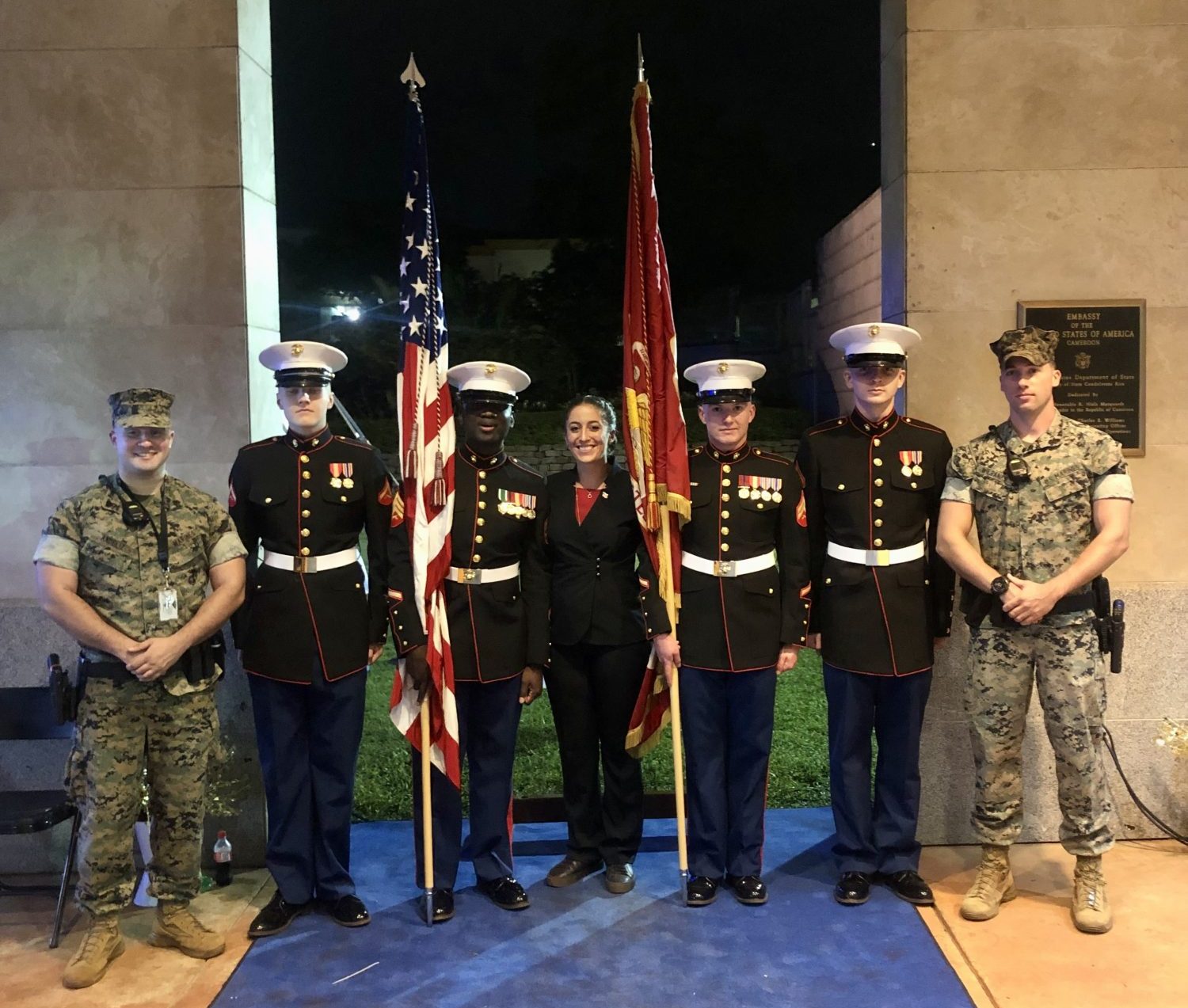 Hannah Fowler posing with members of the U.S. Armed Forces in uniform at the U.S. Embassy in Yaounde, Cameroon