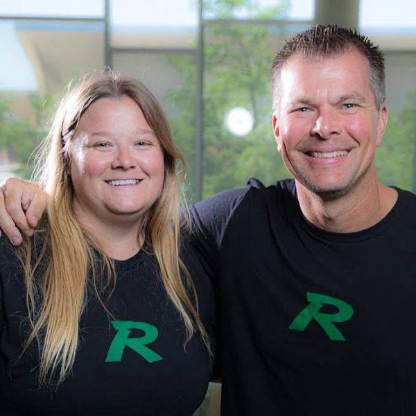 Megan Rakoczy and Deric Swanson smiling wearing RamVision t-shirts