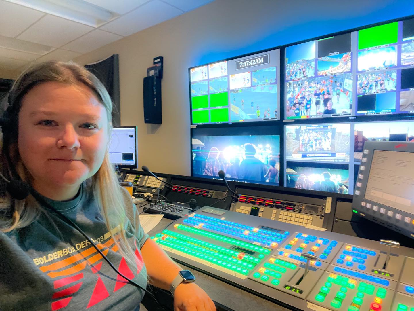 Megan Rakoczy in the control room for media coverage for the Bolder Boulder 10k, directing camera for broadcast