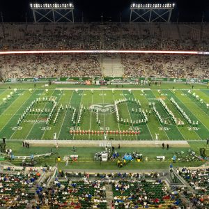 The CSU Marching Band spells "Ann Gill" on the field at a CSU Football game to honor the late dean and share the announcement of the newly named Ann Gill Hall