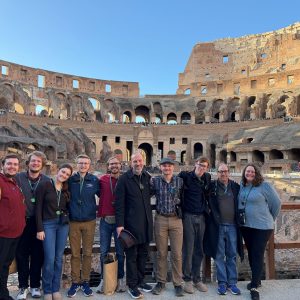 Joel Bacon and his students posing at the Colosseum in Rome